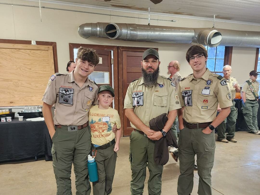 Scouts from Troop 8 stand in the dining hall at Camp Attakapas.